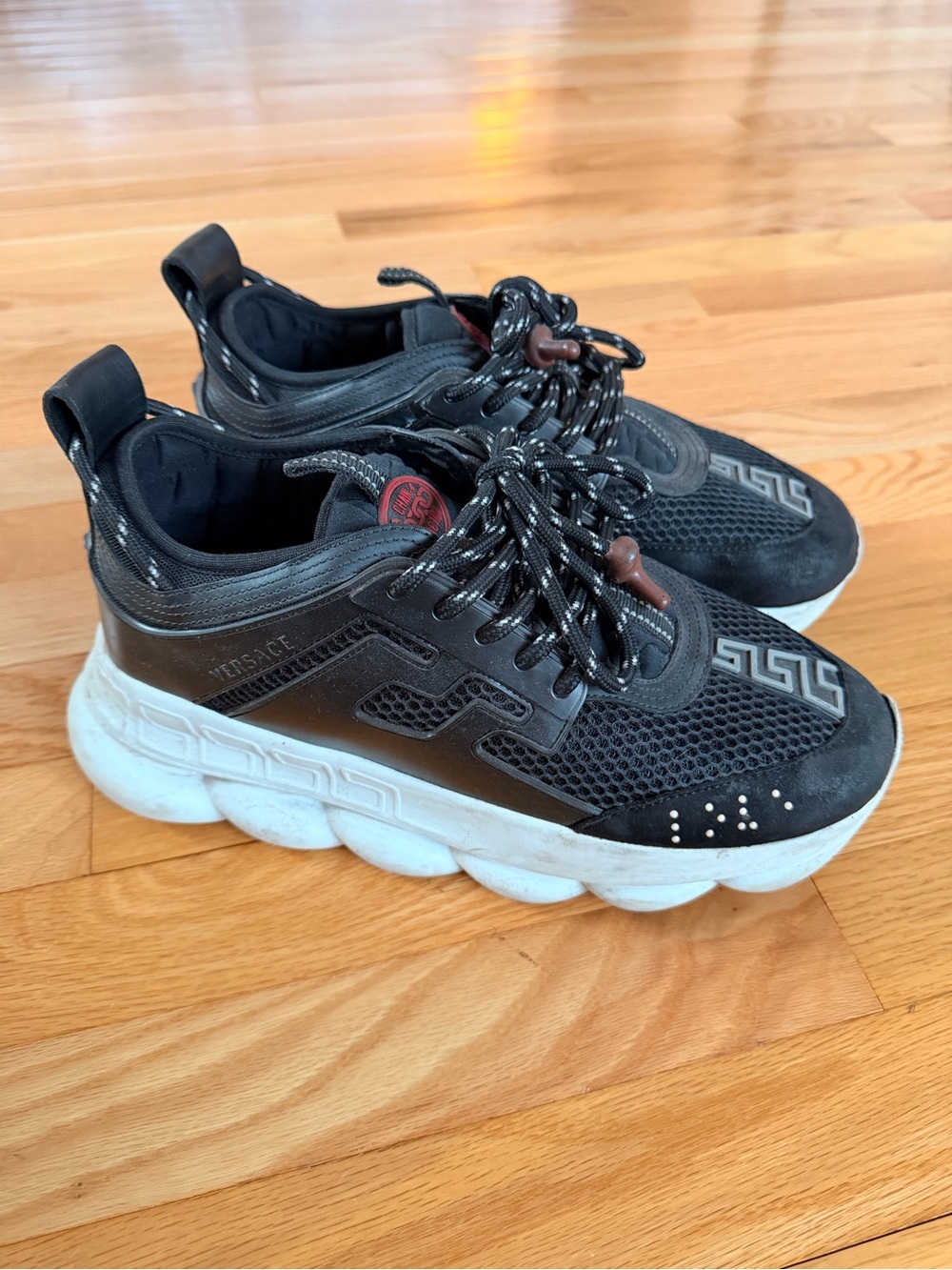 VERSACE CHAIN REACTION SNEAKERS IN BLACK & WHITE